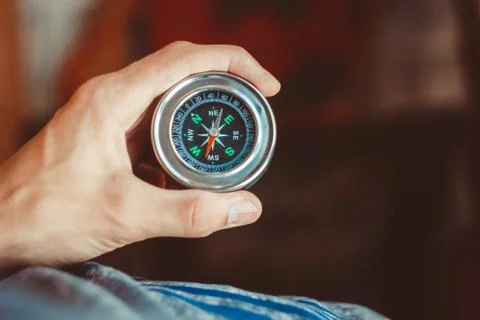 Compass in the hand Stock Photos