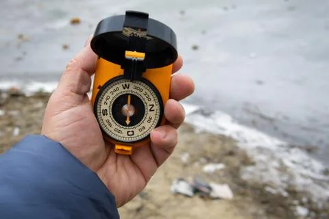 Compass in the hand. Stock Photos
