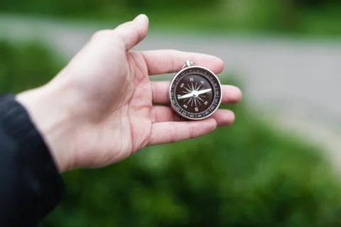 Compass in hand Stock Photos
