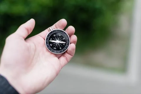 Compass in hand Stock Photos
