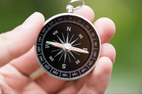 Compass in hand Stock Photos