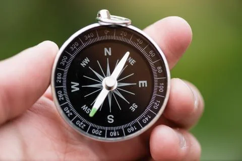 Compass in hand Stock Photos