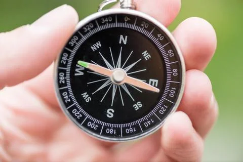 Compass in hand Stock Photos