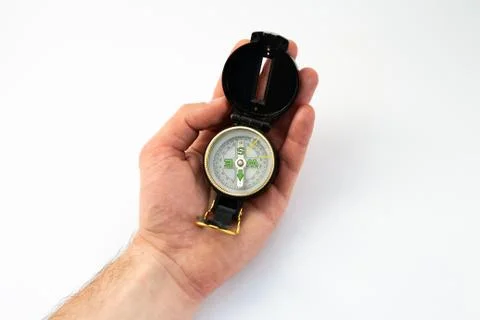 Compass in hand on a white background Foto stock