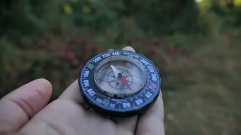Compass in the hands of a man close up 4k Stock Footage 139805425