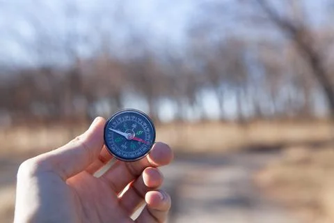 Compass in the hands of a man Stock Photos