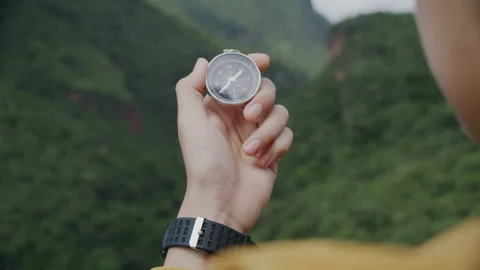 Compass in hands of traveler. Stock Footage 170103816