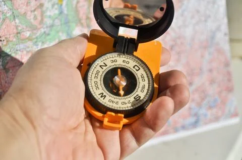 The compass in his hand Stock Photos