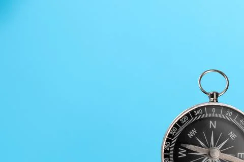 Compass isolated on a blue background. Direction concept Stock Photos