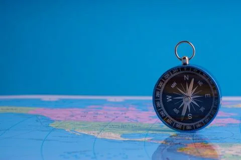 Compass isolated on world map background Stock Photos