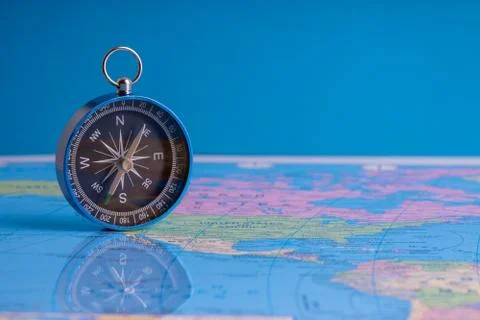 Compass isolated on world map background Фото