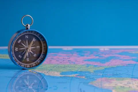 Compass isolated on world map background Stock Photos