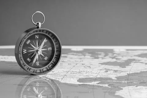 Compass isolated on world map background Fotos Stock