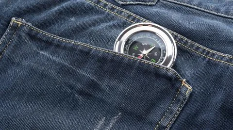 Compass in jeans back pocket Stock Photos