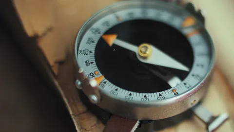 Compass Lying on Split Wood Surface Closeup Stock Footage 307091955