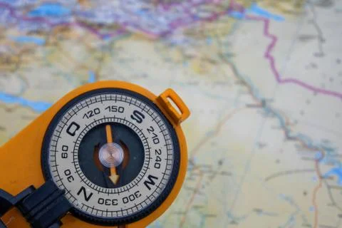 Compass on a map background. Stock Photos
