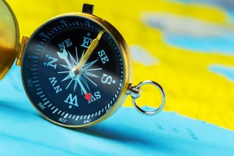 Compass on map background travel Stock Photos