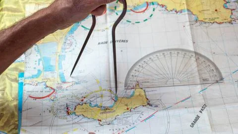 Compass navigation, take up your position and take your route on a chart Stock Photos