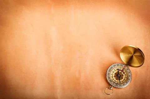 Compass on old paper as a background Stock Photos