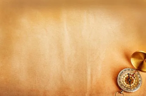 Compass on old paper as a background Stock Photos