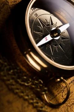 Compass on the old paper background Stock Photos