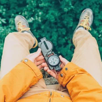 With a compass outdoor Stock Photos
