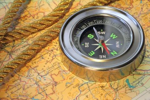 Compass over map Stock Photos