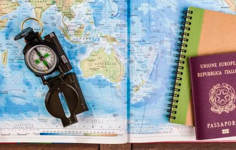 Compass, passport and block notes on map Stock Photos