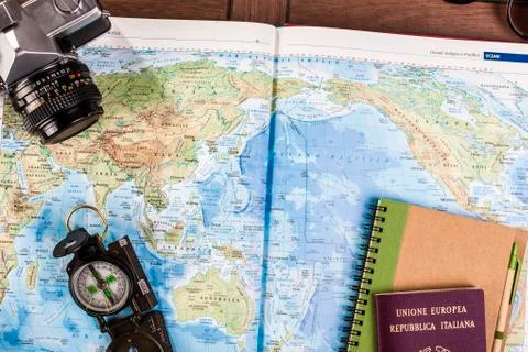 Compass, passport and block notes on map Stock Photos