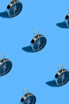 Compass pattern on blue background, travel navigation flat lay texture top vi Stock Photos