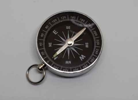 Compass pointing north on white background Stock Photos