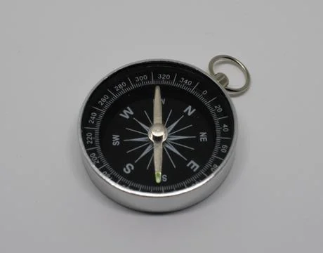 Compass pointing southeast on white background Stock Photos