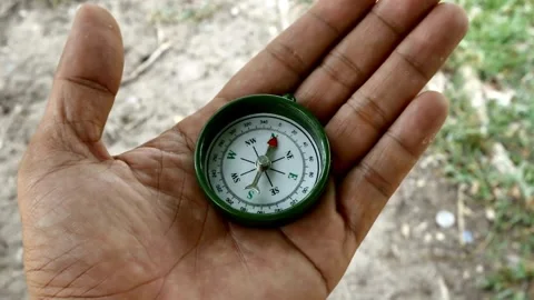 Compass reading and land navigation concept. Navigation, searching, explori.. Stock Footage 257869837