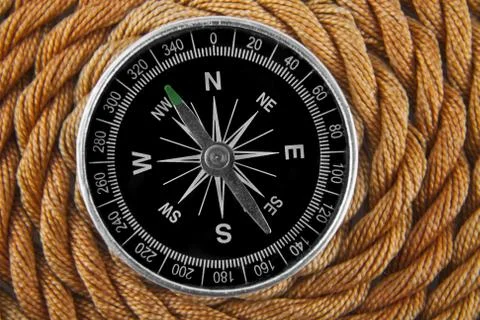 Compass on a rope background Stock Photos