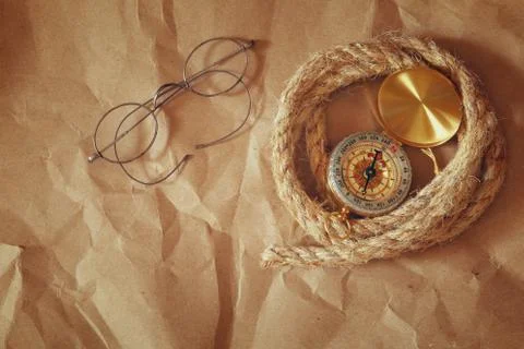 Compass, rope, old glasses. explorer concept Stock Photos