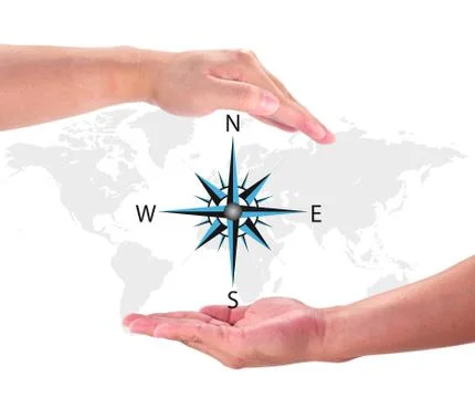 Compass Rose on World Map in hand Foto stock