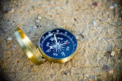 Compass on sand Foto stock