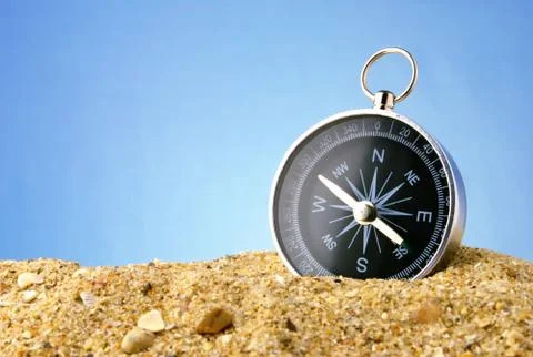 Compass on sand Foto stock