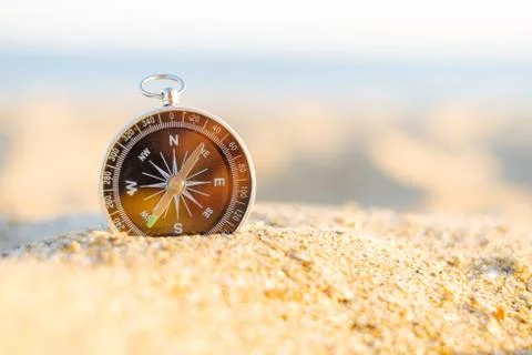 Compass on sand. Stock Photos