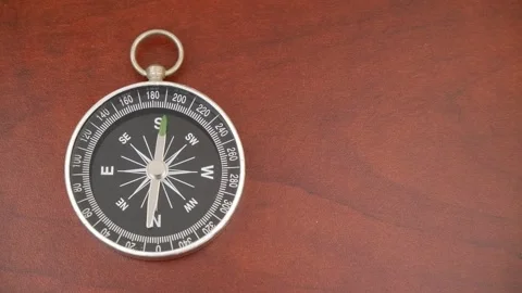 Compass on table with rotating pointer. Stock Footage 269894682