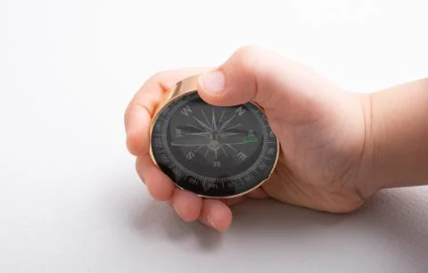 Compass tool in hand on white Stock Photos