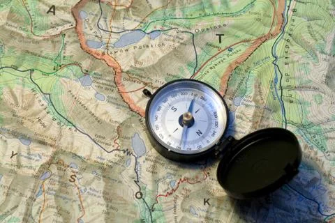 Compass on a topographic map Stock Photos
