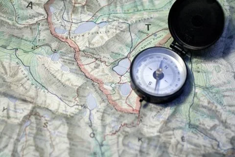 Compass on a topographic map Stock Photos