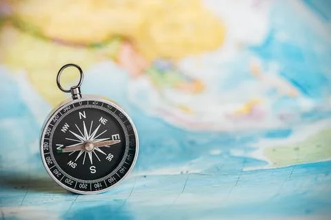 Compass on the tourist map Stock Photos