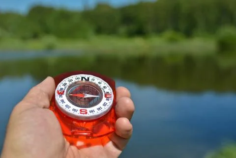 With compass on the walk. Stock Photos