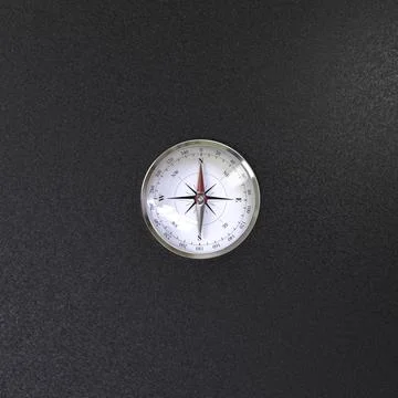 Compass with wind rose over black background view from the top Stock Illustration
