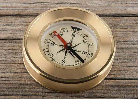 Compass on a wooden background Stock Photos