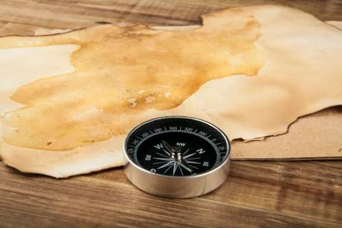 Compass on wooden background Stock Photos