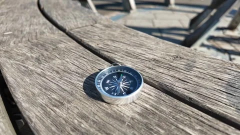 Compass on Wooden Bench for Hiking Navigation Stock Footage 339987795