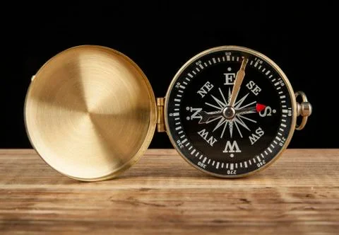 Compass on wooden table with space for text Stock Photos